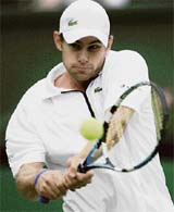 Andy Roddick of the US in action against Thailand�s Danai Udomchoke in the second round at Wimbledon on Wednesday.