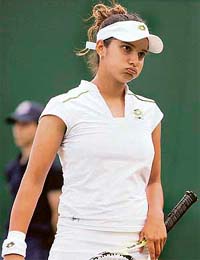 Sania Mirza reacts after losing to Russia�s Nadia Petrova in the second-round match at Wimbledon