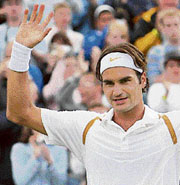 Roger Federer celebrates after defeating Marat Safin in the third round at Wimbledon on Friday.