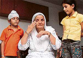 Balbir Kaur with her grandchildren Kamarjit Kaur and Saravpreet Singh in Chandigarh on Wednesday.