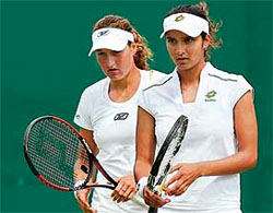 Sania Mirza and Shahar Peer of Israel after losing a point in their doubles match against Lisa Raymond of USA and Samantha Stosur of Australia during the third round at Wimbledon on Wednesday.
