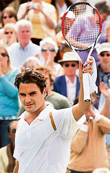 Roger Federer celebrates after beating Juan Carlos Ferrero during the quarterfinal at Wimbledon on Friday.