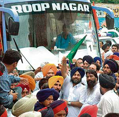 SAD working president Sukhbir Badal flags off a cavalcade of buses carrying pilgrims for the Amarnath yatra in Patiala on Saturday