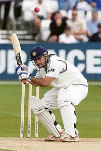 Mahendra Singh Dhoni avoids a short ball from Stuart Broad of England Lions on the third and final day of the warm-up game at Chelmsford