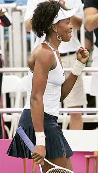 Venus Williams of the USA gestures after beating Russia�s Nadia Petrova during the Fed Cup tennis semifinal in Stowe, Vermont