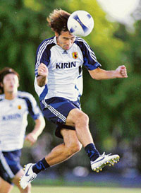 Japanese forward Naohiro Takahara heads a ball during a training session in Hanoi on Friday. Defending champion Japan will battle with Australia in a quarter-final match of the Asian Football Cup in Hanoi on Saturday.