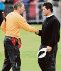 Spain's Sergio Garcia (L) and South Korea's K.J. Choi shake hands after finishing their round after third round play at the 2007 British Open Golf Championship tournament in Carnoustie, Scotland, on Sunday.