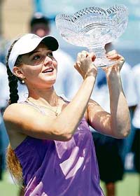 Russia�s Anna Chakvetadze lifts the trophy after defeating Japan�s Akiko Morigami 6-1, 6-3 in the final of the Western & Southern Financial Group Women�s Open tennis tournament in Cincinnati