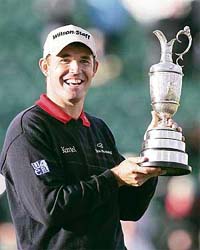 Ireland�s Padraig Harrington holds the Claret Jug trophy after winning the British Open Golf Championship in Carnoustie, Scotland