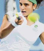 Sania Mirza hits a forehand against Akiko Morigami of Japan during the first round of the Bank of the West Classic in Stanford, California