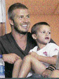 Los Angeles Galaxy�s soccer star David Beckham and his son Romeo watch his team play against CF Pachuca in Carson, California.