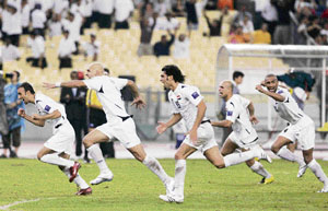 Iraqi players celebrate after winning the Asian Cup football semifinal against South Korea in Kuala Lumpur on Wednesday.
