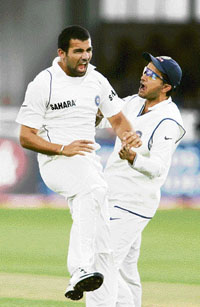 Indian pace bowler Zaheer Khan (left) celebrates with Sourav Ganguly after dismissing England�s Michael Vaughan on the first day of the second Test at Trent Bridge, Nottingham