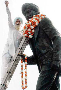 A member of the Shaheed Udham Singh Foundation, Jagdish Singh, raises slogans after paying tributes to the martyr in Amritsar on Tuesday.