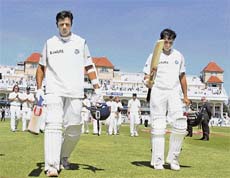 Rahul Dravid (L) and Sourav Ganguly leave the pitch after beating England in their second Test at Trent Bridge in Nottingham on Tuesday. 