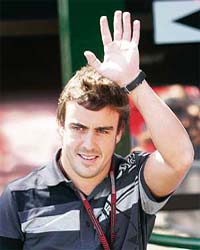 McLaren Formula One driver Fernando Alonso of Spain acknowledges the crowd in Budapest
