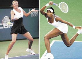 Maria Sharapova (L) of Russia returns a volley to Thailand's Tamarine Tanasugarn on way to 6-1 6-3 victory in the second round, while Wimbledon champion Venus Williams of the USA sailed past Virginie Razzano of France 6-2 6-4 at the Acura Classic tennis tournament in Carlsbad, California