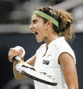 Sania Mirza celebrates victory over Martina Hingis in the East West Bank Classic tournament.