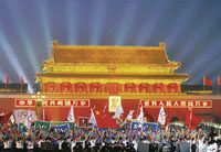 Tiananmen Gate is lit up as China kicked off the final year countdown to the Beijing Olympics with a spectacular ceremony on a dazzlingly lit Tiananmen Square on Wednesday.