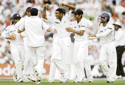 Anil Kumble (centre) celebrates with team-mates after taking the wicket of England captain Michael Vaughan on the third day of the final Test at the Oval in London on Saturday. � AP/PTI photo