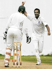 Irfan Pathan celebrates after David Obuya was caught by wicketkeeper Mahesh Rawat