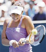 Serbia�s Ana Ivanovic hits a return to compatriot Jelena Jankovic during the semifinals of the WTA tennis tournament in Carson, California, on Saturday. Ivanovic won 4-6, 6-3, 7-5. 