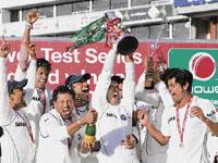Indian captain Rahul Dravid (centre) holds the trophy for winning the Test series against England at the Oval cricket ground in London on Monday.
