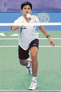 Chetan Anand returns a shot against Indonesia's Sony Dwi Kuncoro during the men's singles first round of the Malaysian World Badminton Championships on Tuesday. Kuncoro won 11-21, 21-14, 21-18.