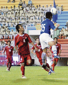 Indian captain Baichung Bhutia (in blue) in action against Cambodia during the opening match of the ONGC Nehru Cup Football Tournament in New Delhi on Friday.
