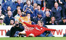 Liverpool's Fernando Torres celebrates after scoring during their English Premier League soccer match against Chelsea in Liverpool, northern England on Sunday.