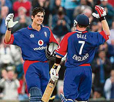 England cricketer Alistair Cook (L) celebrates scoring a century against India with teammate Ian Bell during the first NatWest One Day International match at the Rosebowl in Hampshire.
