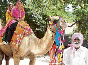 Two girls take a joy ride at a function organised at Bathinda on Sunday to celebrate Teej festival.