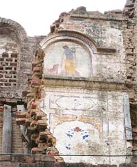 The damaged murals on one of the dilapidated buildings at Bundala village in Amritsar