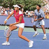 Sania Mirza and Mahesh Bhupathi in action during their first round match against Elena Likhovtseva and Daniel Nestor.