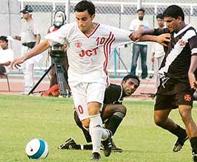 Eduardo Escobar of JCT battles to take control of ball against Vasco Sports Club of Goa in the first match of the 29th Hero Federation Football Cup Tournament at Guru Nanak Stadium, Ludhiana