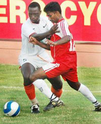 Nicholas Muyoti (left) of Sporting Clube de Goa battles it out with Ramchandrarn of Army XI in the 29th Hero Federation Football Tournament at Guru Nanak Stadium, Ludhiana, on Wednesday.