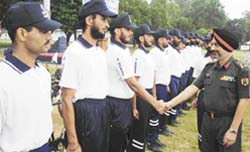 Brigadier J.P. Singh shakes hand with members of the cycle expedition before he flagged it off at Pathankot