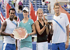 Leander Paes (left) and Meghann Shaughnessy (second from left) hold the runners-up trophy, while Victoria Azarenka and Max Mirnyi (right) pose with the winners� trophy after the mixed doubles final at the US Open in New York on Thursday. Azarenka and Mirnyi won 6-4, 7-6. 