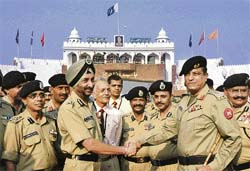 Officers of the BSF are welcomed by Pakistan Rangers at the Wagah check post near Amritsar
