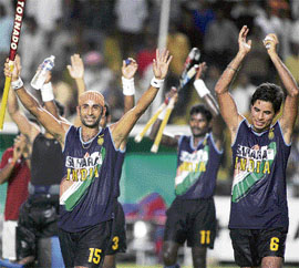 Prabhjot Singh (left) and his team-mates acknowledge the crowd after India beat Japan 4-1 in the semifinal of the Asia Cup hockey tournament in Chennai on Saturday.
