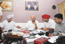 Vigilance Bureau sleuths during a raid at the Mota Singh Nagar house of former militant-turned-police cat Sukhjinder Singh Sukhi in Jalandhar on Sunday. 