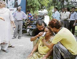 Relatives console mother of Sonu, who was stabbed to death in a clash between the Gujjars and the Baazigars at Jammu Ghaliari village near Pathankot