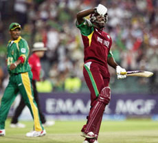 West Indies batsman Chris Gayle celebrates making the highest score in ICC T20 Cricket World Cup opening match against South Africa at Wanderers in Johannesburg on Tuesday.