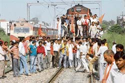 Activists of Sri Rameshwar Ram Setu Raksha Munch block the Amritsar-Delhi track near Adda Hoshiarpur in Jalandhar