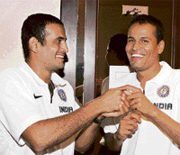 Indian cricket players and brothers Irfan Pathan, left, and Yusuf Pathan share in light moment in Durban on Tuesday.