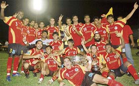 Members of the East Bengal team celebrate after winning the Federation Cup football tournament in Ludhiana