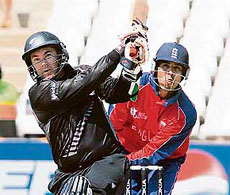 Craig McMillan hits a six as England�s wicketkeeper Vikram Solanki (right) looks on in ICC World Twenty20 Cricket match on Tuesday at the Kingsmead Cricket Stadium in Durban.