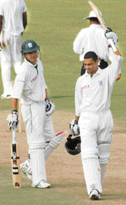 Petersen raises his bat after scoring a century during the four-day match between India �A� and South Africa �A� in Dharamsala on Wednesday.