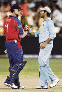 England�s Andrew Flintoff (left) congratulates Yuvraj Singh after India won their Twenty20 World Cup match on Wednesday. 