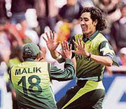 Pakistan�s Umar Gul (right) celebrates with captain Shoaib Malik after dismissing New Zealand�s Peter Fulton during the first semifinal of the Twenty20 World Cup at Newlands in Cape Town on Saturday.
